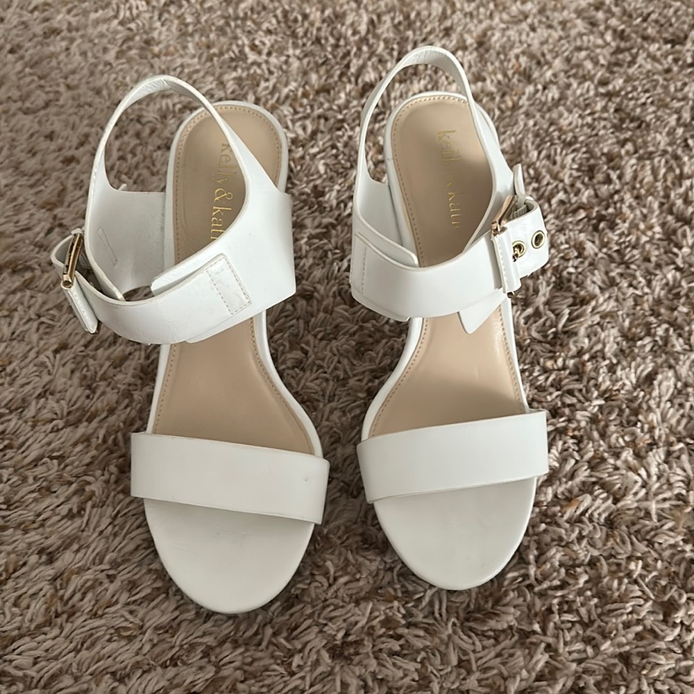 White dress sandals with 3.5 inch heel, gold accents on buckle